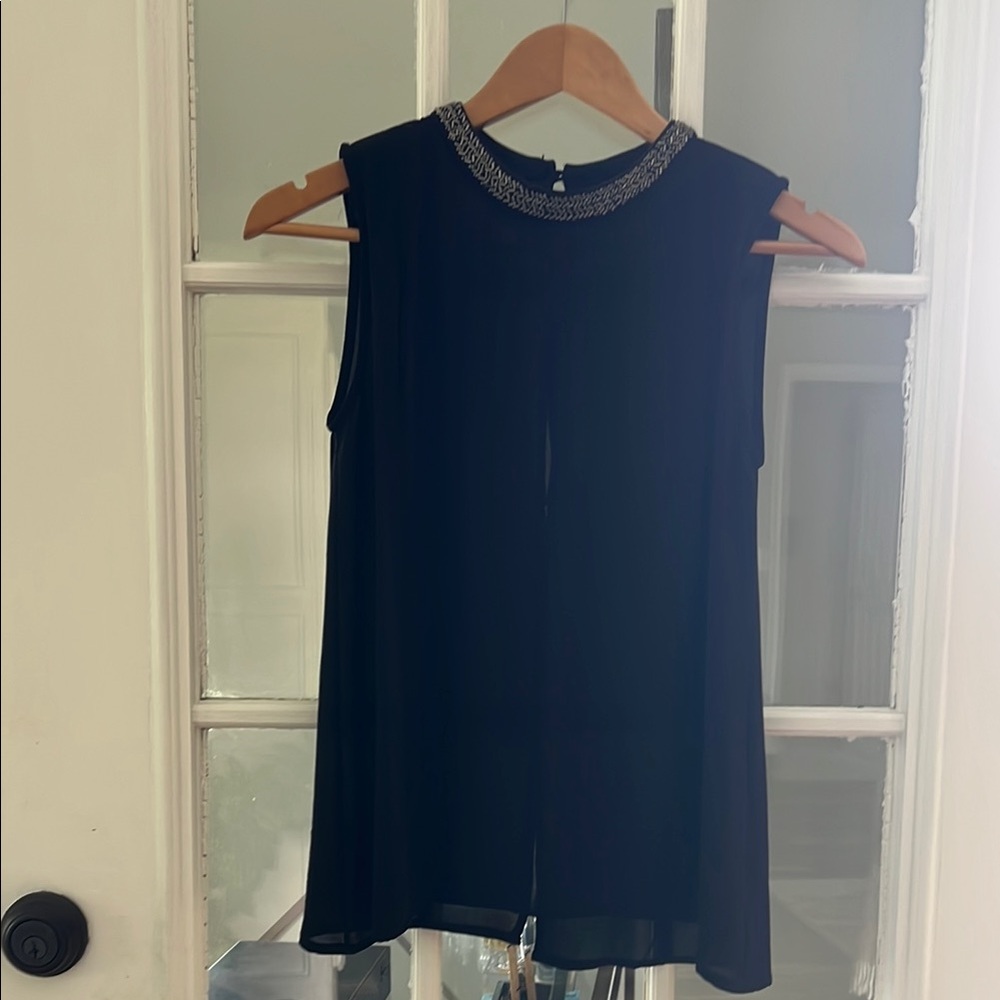 Elegant Black Sleeveless Top with Embellished Neckline